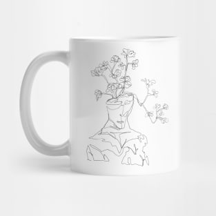 A man statue with flowers growing Mug